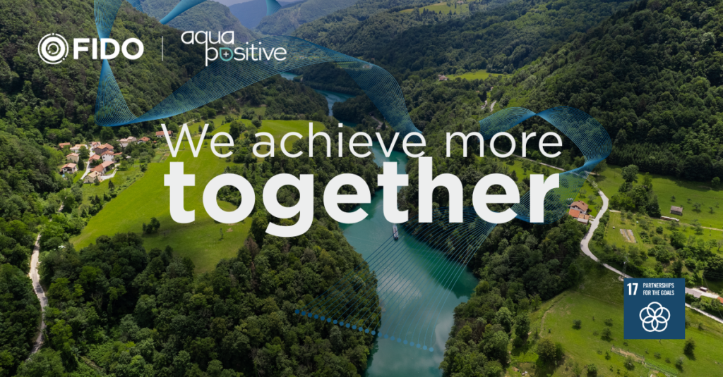 Achieve more together Photo of lush green river valley with the words We Achieve More Together and the logos of FIDO Tech and Aqua Positive
